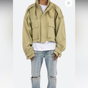 Tan cropped jacket.